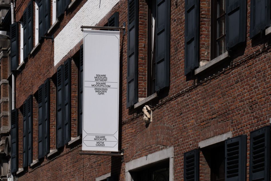 Vertical banner mockup on a brick building exterior, editable template for designers, high-resolution mockups, downloadable product, realistic setting for presentations.